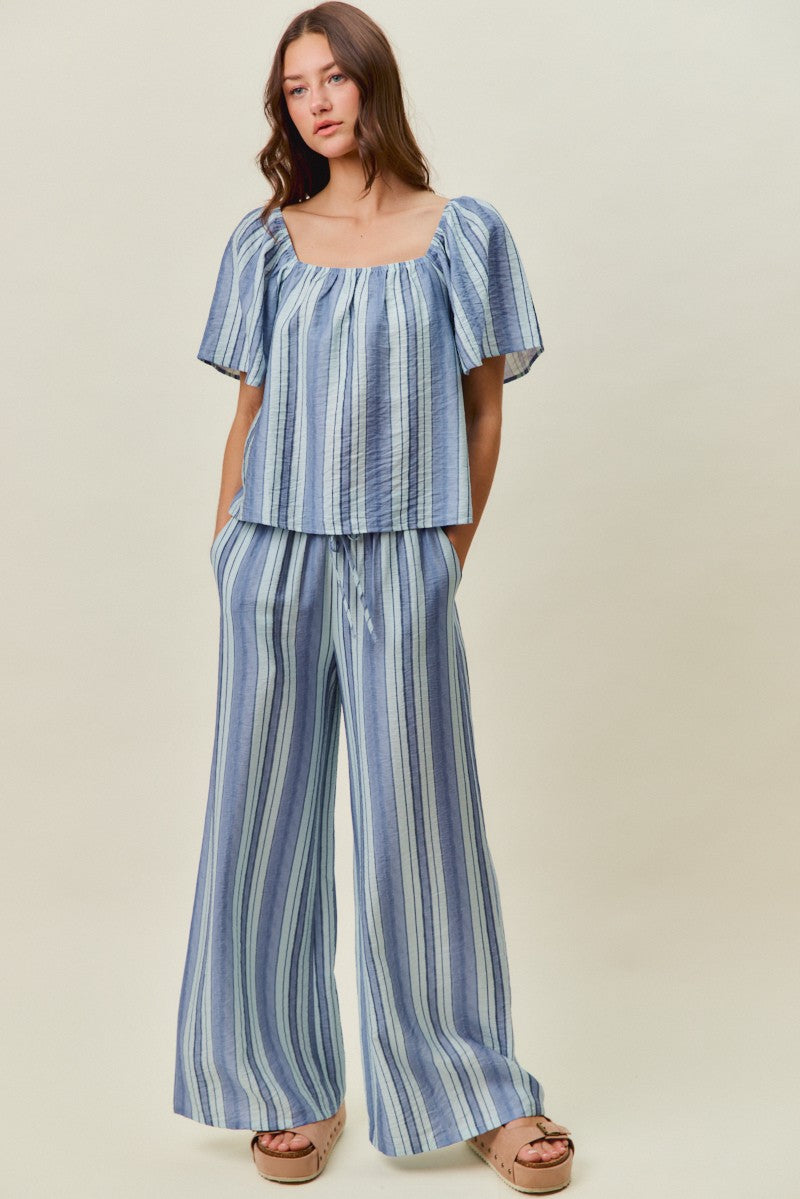 A women's lightweight square-neck blouse featuring vertical stripes in blue tones with loose flutter sleeves and a relaxed fit.