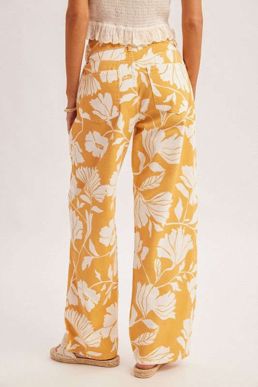 High-waisted straight-leg jeans in a caramel and ivory oversized floral print featuring a classic five-pocket design and a button-and-zip fly.