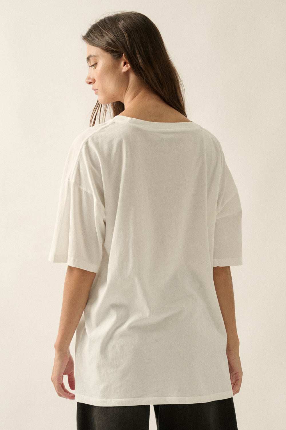 An ivory graphic tee featuring a black Dalmatian dog design, a soft crew neckline, and a relaxed, comfortable fit for everyday wear.