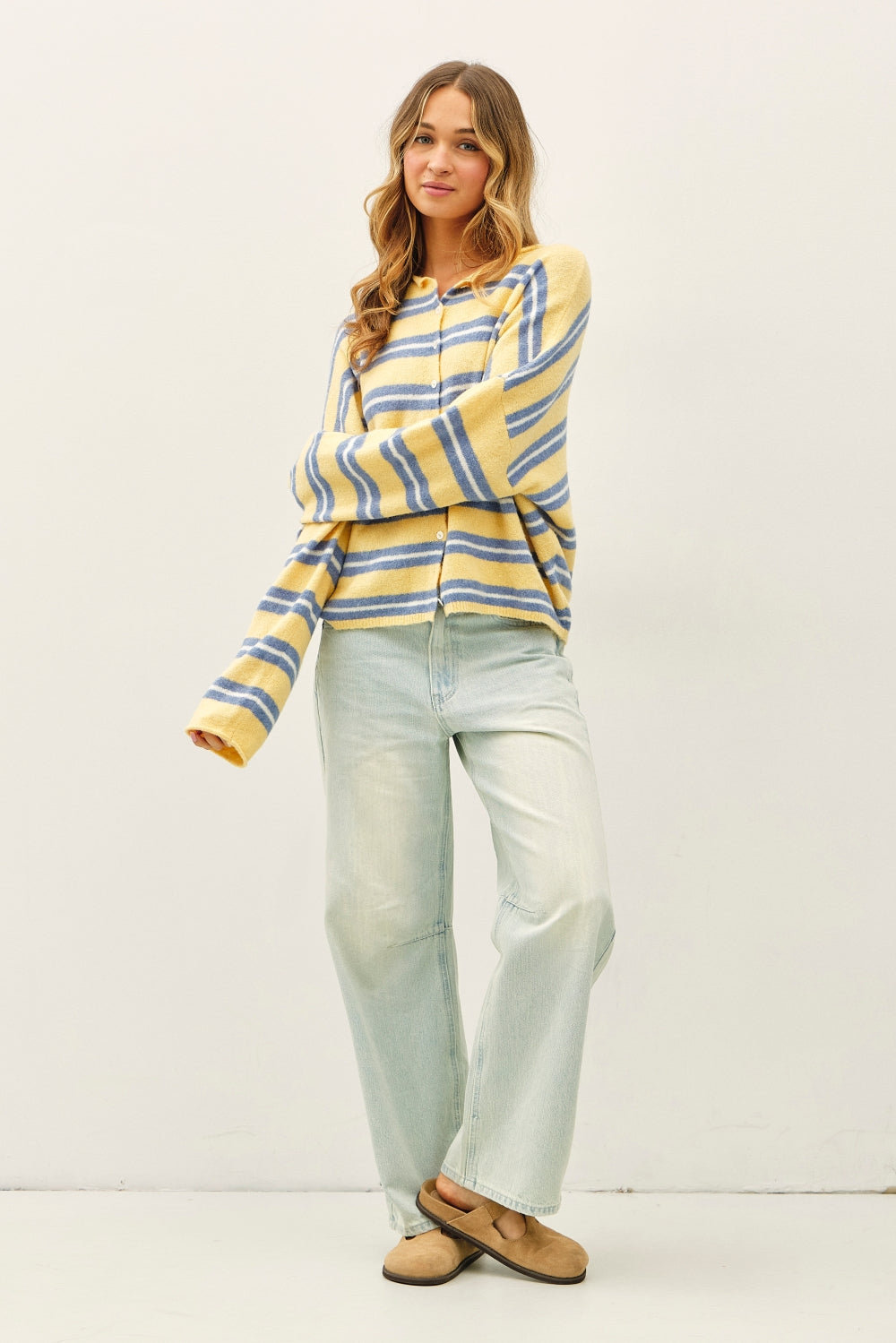 Soft knit varsity striped long sleeve cardigan in honey yellow, blue, and white. Raw edges