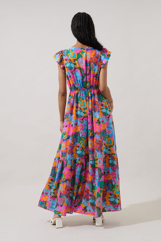 A fuchsia multi-color floral maxi dress featuring a V-neckline, functional button-down front, tiered skirt, flutter sleeves, and hidden side pockets.