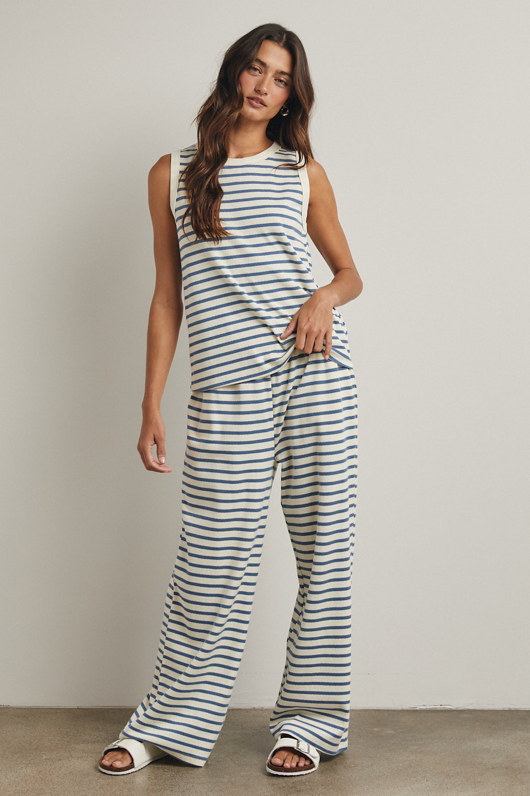 Blue + Cream striped set
Top is a tank with a high rounded collar
The bottoms contain an elastic waist and pockets