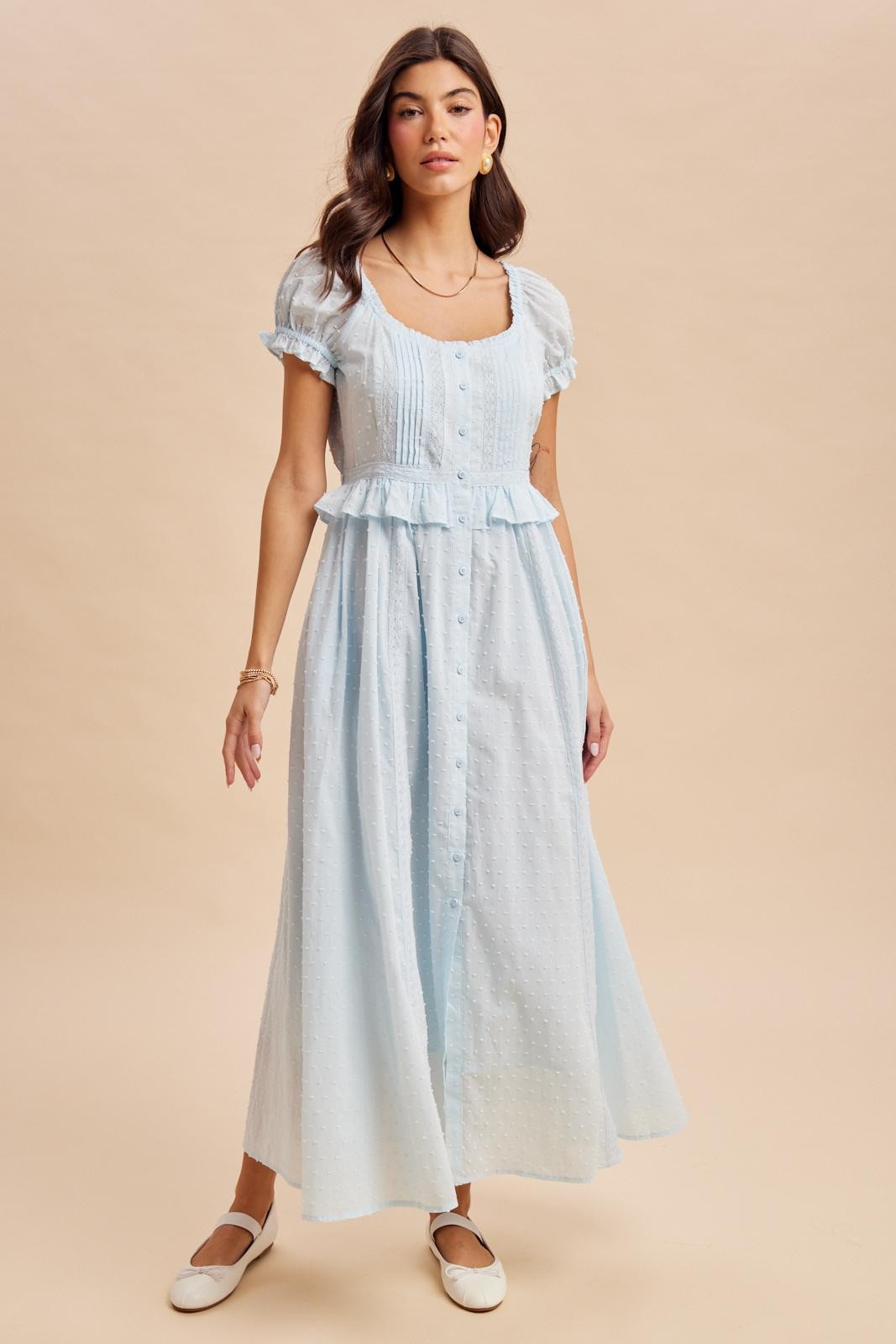Maxi Dress in airy blue is a lightweight, feminine yellow maxi dress featuring delicate Swiss dot fabric, puff sleeves, and a flattering button-front bodice. 