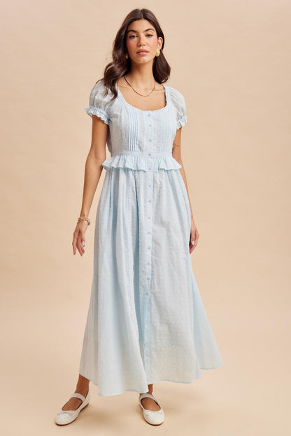 Maxi Dress in airy blue is a lightweight, feminine yellow maxi dress featuring delicate Swiss dot fabric, puff sleeves, and a flattering button-front bodice. 