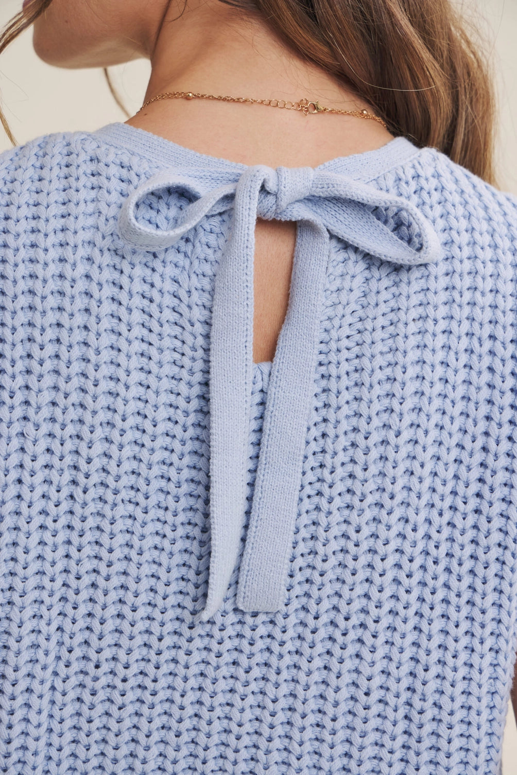 A women's sky blue mixed media midi dress featuring a sleeveless open-knit sweater vest top and an attached gathered striped midi skirt.