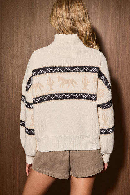 A women's cream knit zip-up collared sweater jacket featuring a southwestern geometric pattern, tan galloping horse motif, high collar, and front slip pockets.