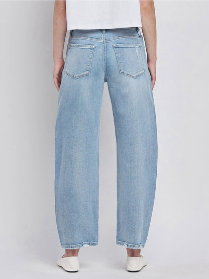 Women's light wash high-rise barrel leg jeans featuring a relaxed curved silhouette, subtle distressing, and an ankle-length hem.