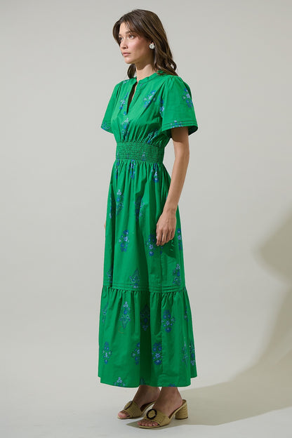100% cotton poplin – soft but structured
Smocked waistline for a flattering fit
Hidden side pockets
Split neckline
Single tier pleated hem detail
Kelly Green with blue floral details 