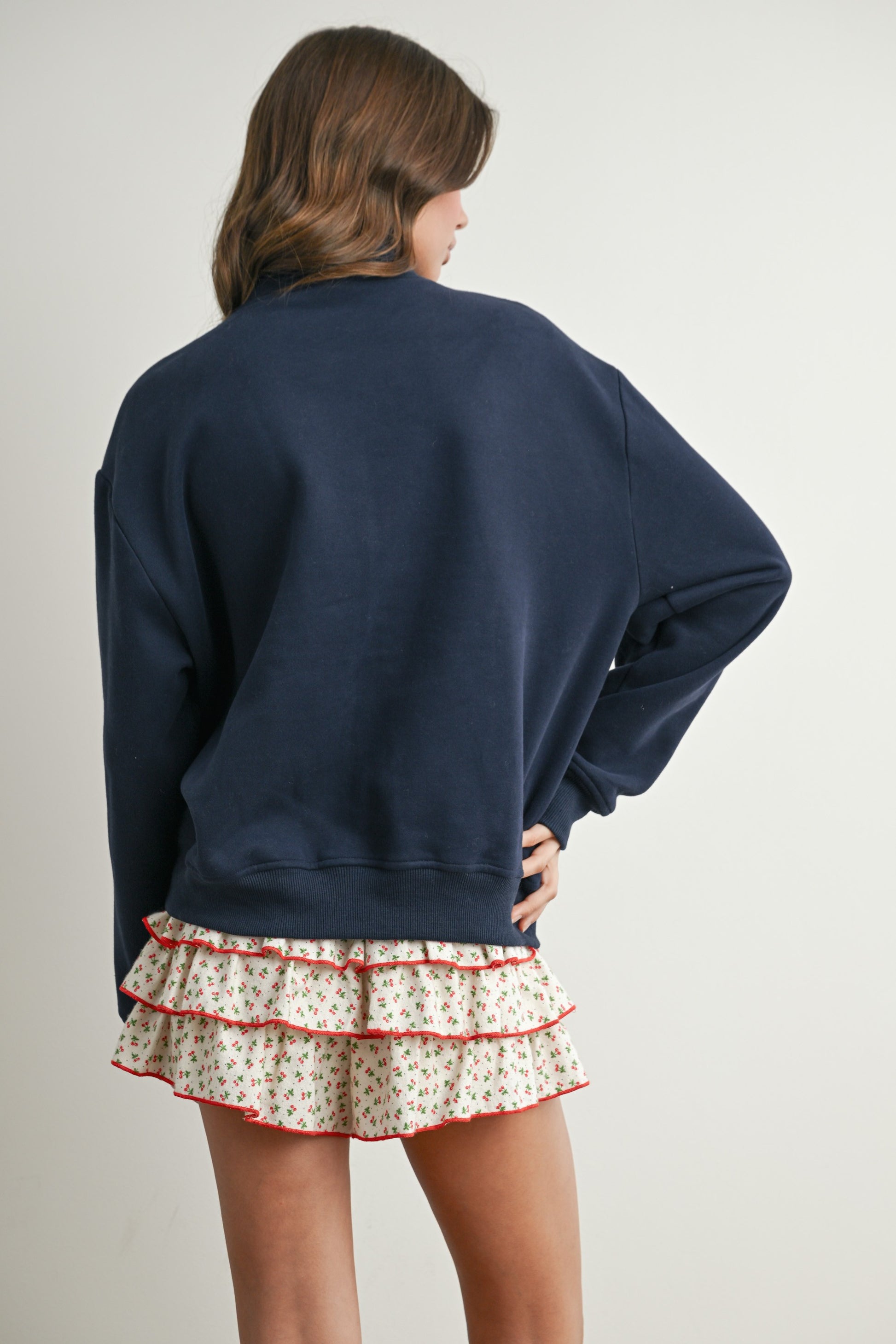 Long-sleeve pullover, half-zip navy sweater with felted USA in the center. 