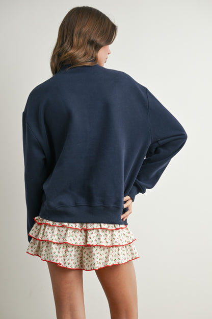 Long-sleeve pullover, half-zip navy sweater with felted USA in the center. 