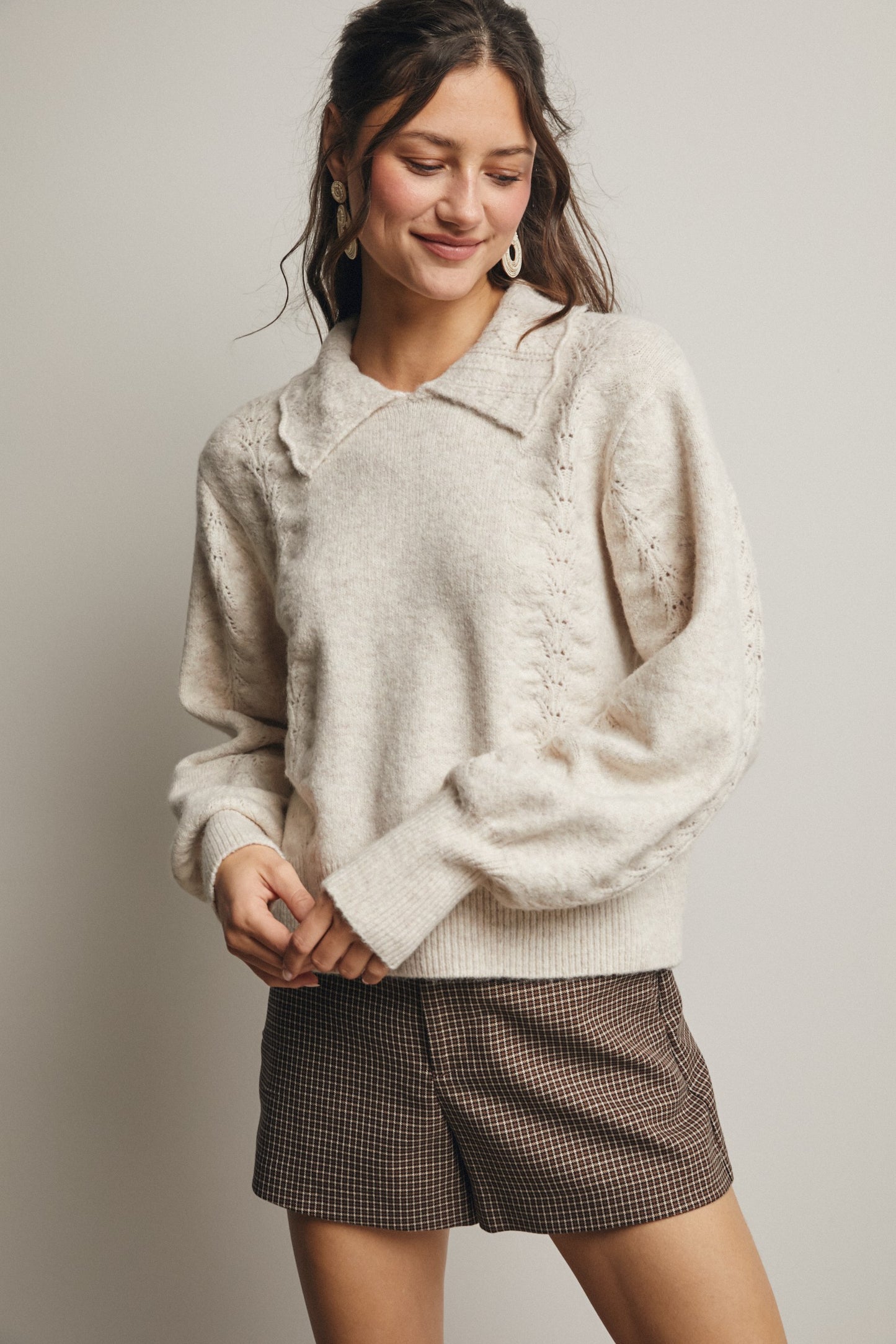 Soft Knit Fabric
Pointelle Detailing
Collared Neckline
Relaxed Silhouette
Balloon Sleeves
Ribbed Trim