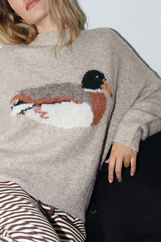 Knit sweater in taupe with a duck graphic in the center. 