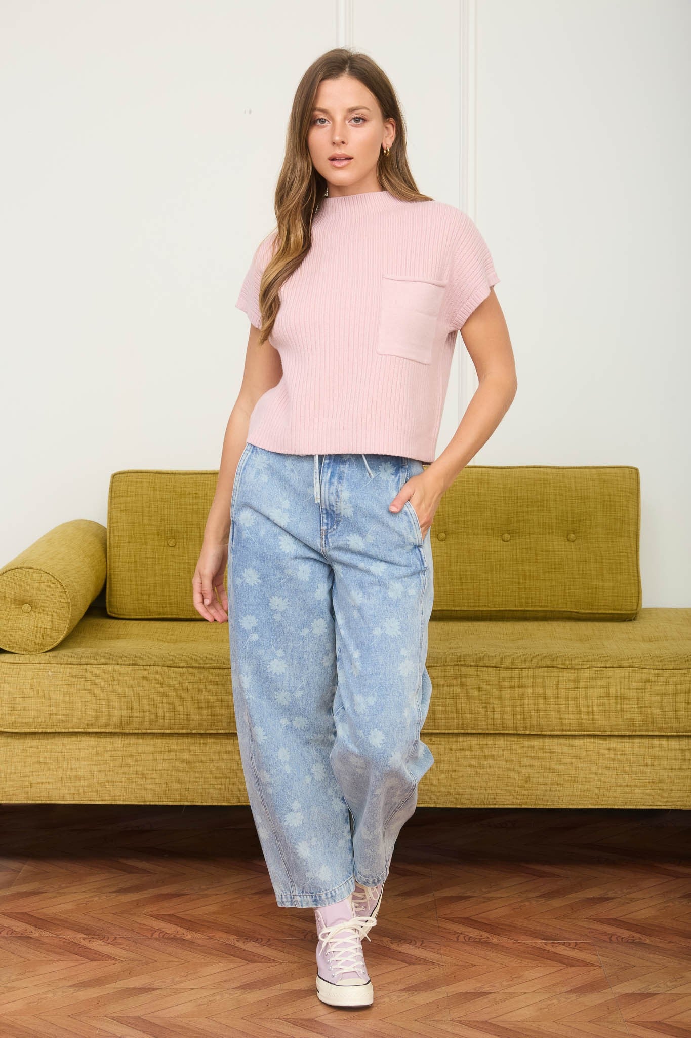 Dandelion printed cropped slight barrel light wash denim jeans. Button and zipper closure with a waist tie. 