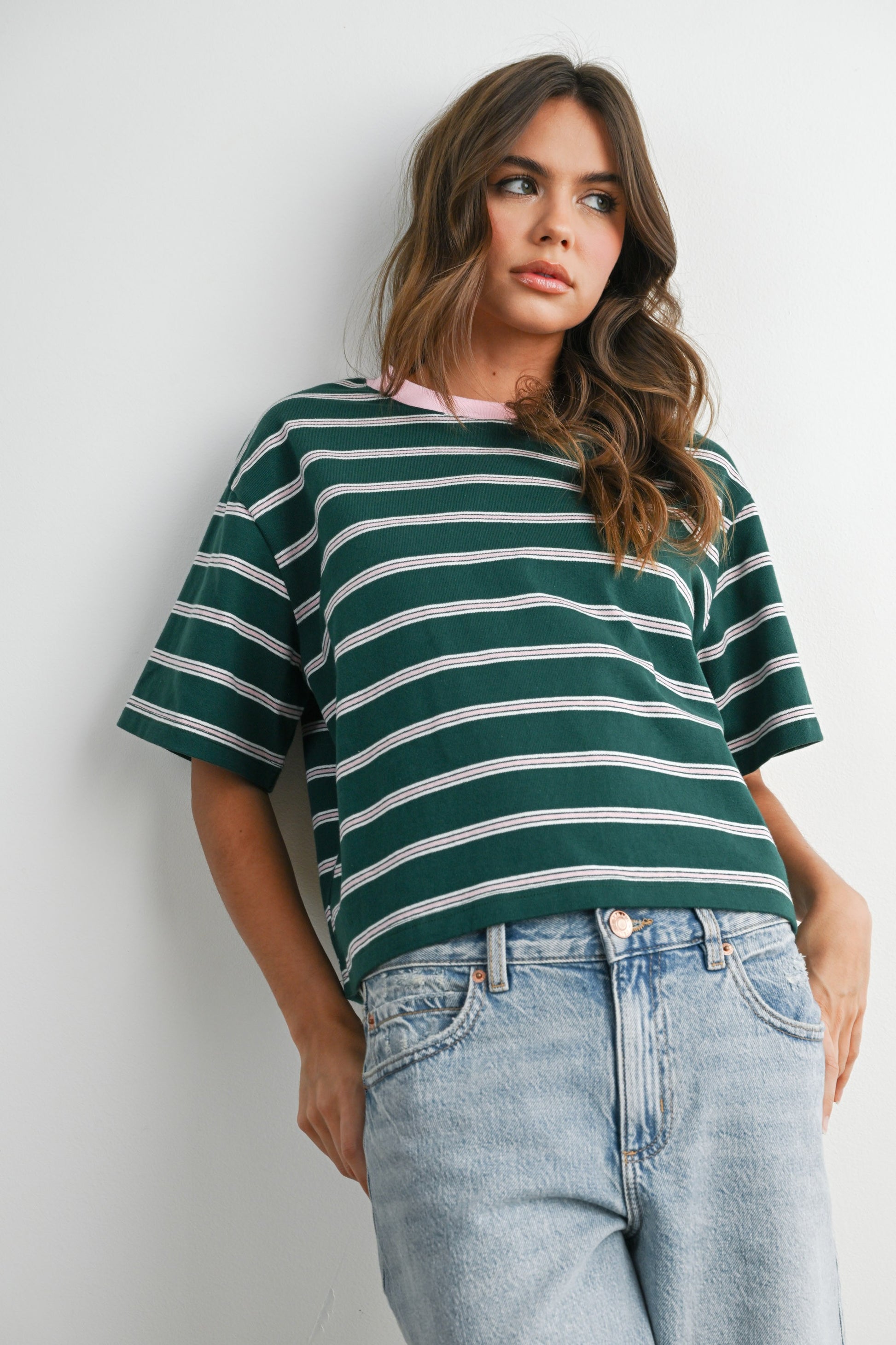 Boxy cut green and light pink striped cropped tee. 