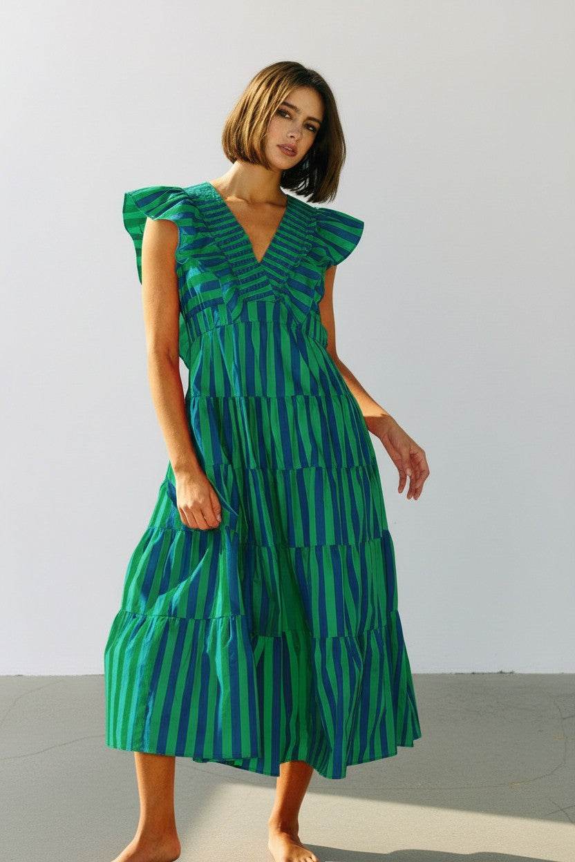 Striped Ruffle-Sleeve Tiered Cotton Midi Dress. With a bold vertical stripe pattern, a deep V-neckline, and soft ruffle sleeves in green and blue. 
