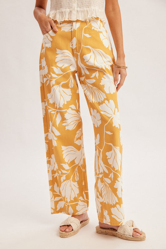 High-waisted straight-leg jeans in a caramel and ivory oversized floral print featuring a classic five-pocket design and a button-and-zip fly.