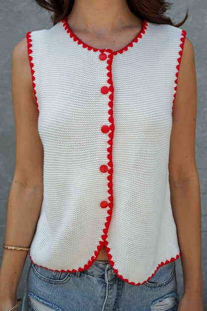 A women's sleeveless textured knit button-down vest tank top in ivory featuring a red scalloped contrast trim along the neckline, front placket, armholes, and hem.