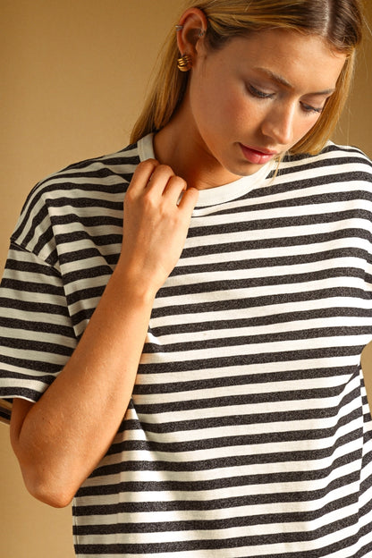 A women's relaxed short-sleeve t-shirt in a charcoal gray and white horizontal stripe pattern with a classic crew neckline.