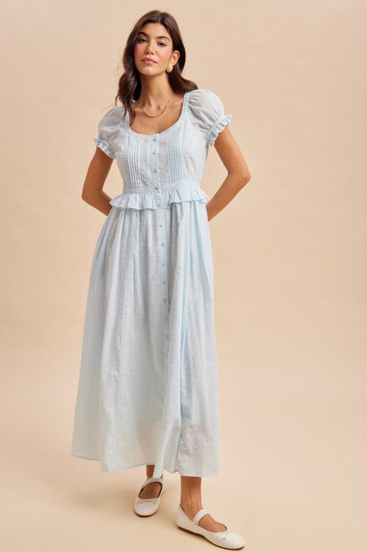 Maxi Dress in airy blue is a lightweight, feminine yellow maxi dress featuring delicate Swiss dot fabric, puff sleeves, and a flattering button-front bodice. 
