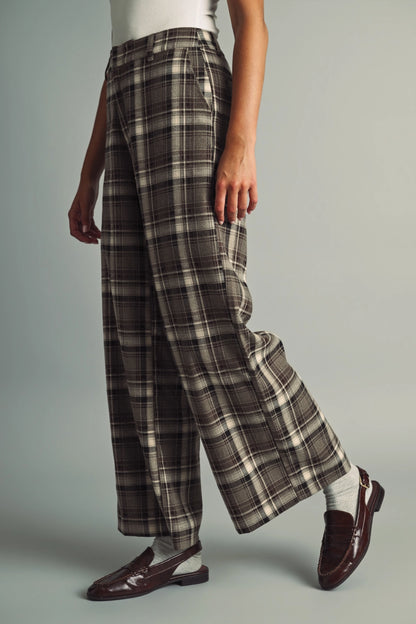 A women's high-waisted wide-leg plaid trousers in black and warm brown featuring front pleats, belt loops, and a relaxed straight drape.
