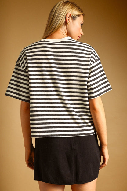 A women's relaxed short-sleeve t-shirt in a charcoal gray and white horizontal stripe pattern with a classic crew neckline.