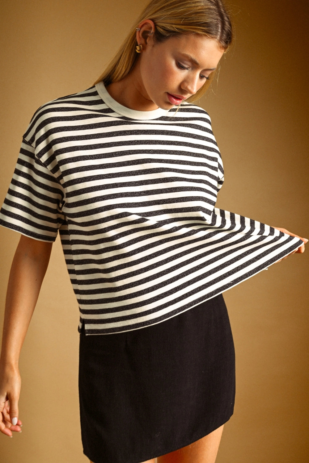 A women's relaxed short-sleeve t-shirt in a charcoal gray and white horizontal stripe pattern with a classic crew neckline.