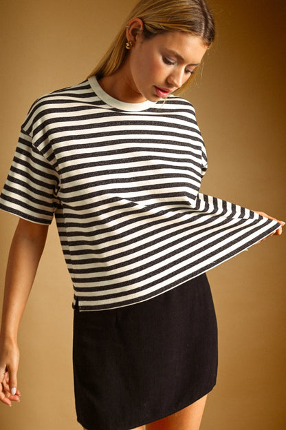 A women's relaxed short-sleeve t-shirt in a charcoal gray and white horizontal stripe pattern with a classic crew neckline.