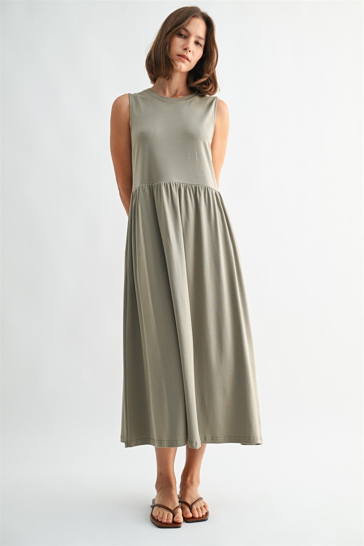 Olive knit tank midi dress. T-shirt neck with pockets. 