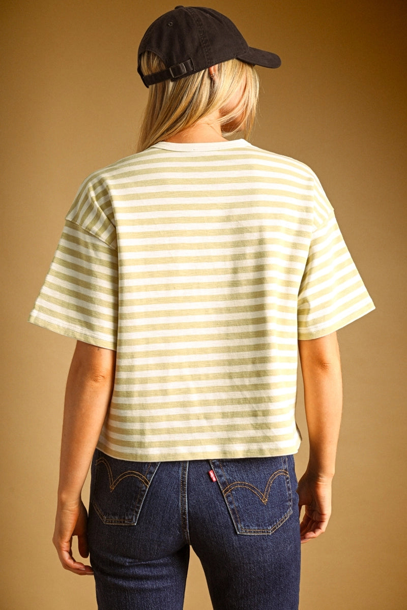 A women's short-sleeve crewneck t-shirt featuring a pastel lemon yellow and white horizontal stripe pattern in a relaxed fit.