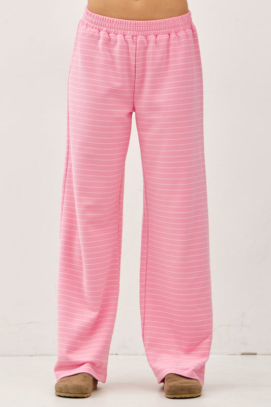 Women's flowy wide-leg lounge pants in bubblegum pink and ivory micro-stripes featuring a flat elastic waistband and relaxed silhouette.
