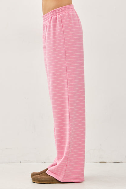 Women's flowy wide-leg lounge pants in bubblegum pink and ivory micro-stripes featuring a flat elastic waistband and relaxed silhouette.
