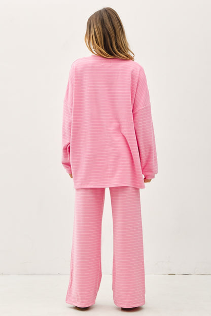 Women's flowy wide-leg lounge pants in bubblegum pink and ivory micro-stripes featuring a flat elastic waistband and relaxed silhouette.