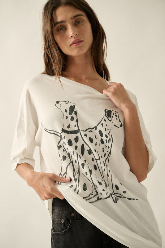 An ivory graphic tee featuring a black Dalmatian dog design, a soft crew neckline, and a relaxed, comfortable fit for everyday wear.