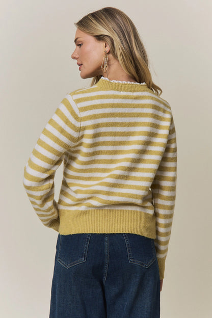 A women's long-sleeve knit henley sweater in mustard yellow and cream horizontal stripes featuring a white eyelet lace trim along the neckline and button placket.