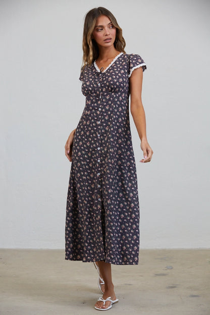 A women's short flutter sleeve midi dress in antique black featuring a pink vintage rose floral print, white scalloped lace trim along the V-neckline, and a full button-down front.