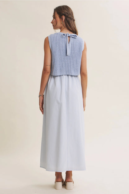 A women's sky blue mixed media midi dress featuring a sleeveless open-knit sweater vest top and an attached gathered striped midi skirt.