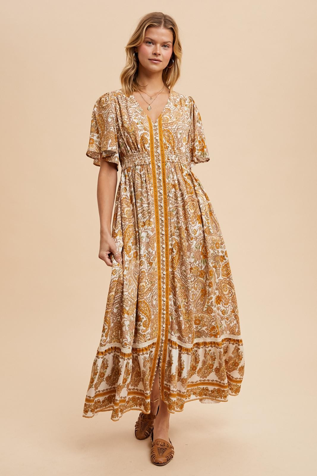 The Gisborne Flutter Sleeve Floral Maxi Dress in Antique Gold