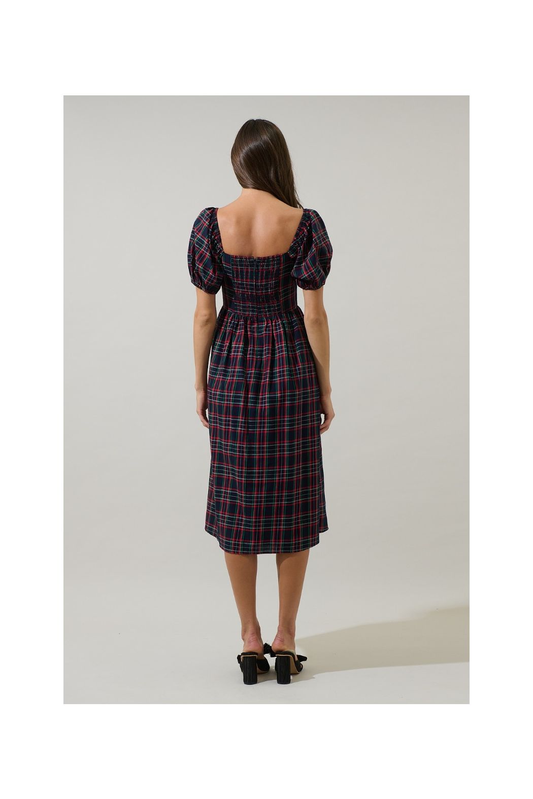 A women's navy multi plaid midi dress featuring short puff sleeves, a sweetheart neckline, a fitted waist, and deep side pockets.