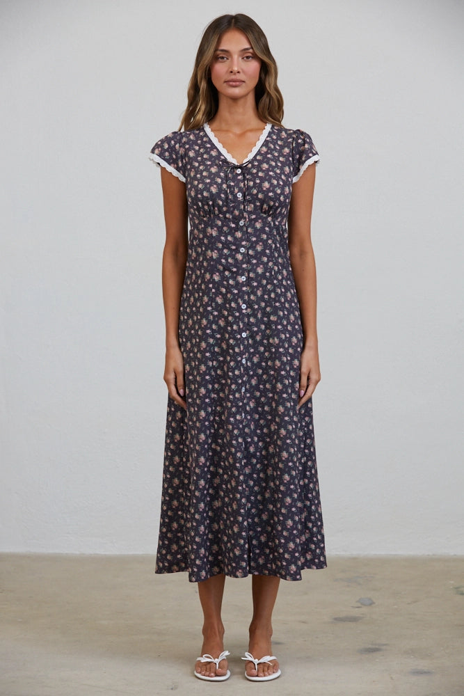 A women's short flutter sleeve midi dress in antique black featuring a pink vintage rose floral print, white scalloped lace trim along the V-neckline, and a full button-down front.