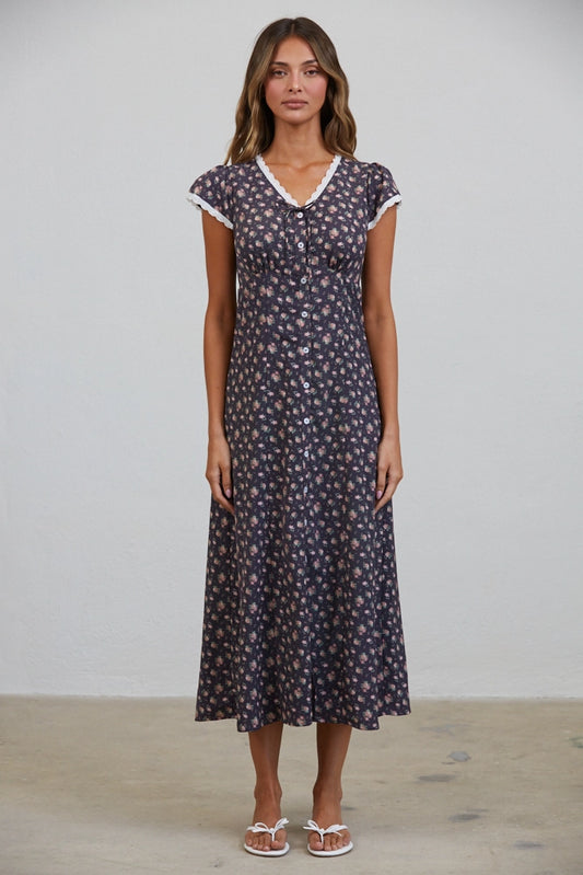 A women's short flutter sleeve midi dress in antique black featuring a pink vintage rose floral print, white scalloped lace trim along the V-neckline, and a full button-down front.
