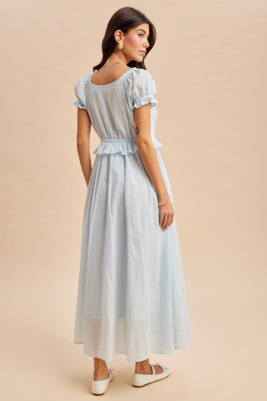 Maxi Dress in airy blue is a lightweight, feminine yellow maxi dress featuring delicate Swiss dot fabric, puff sleeves, and a flattering button-front bodice. 
