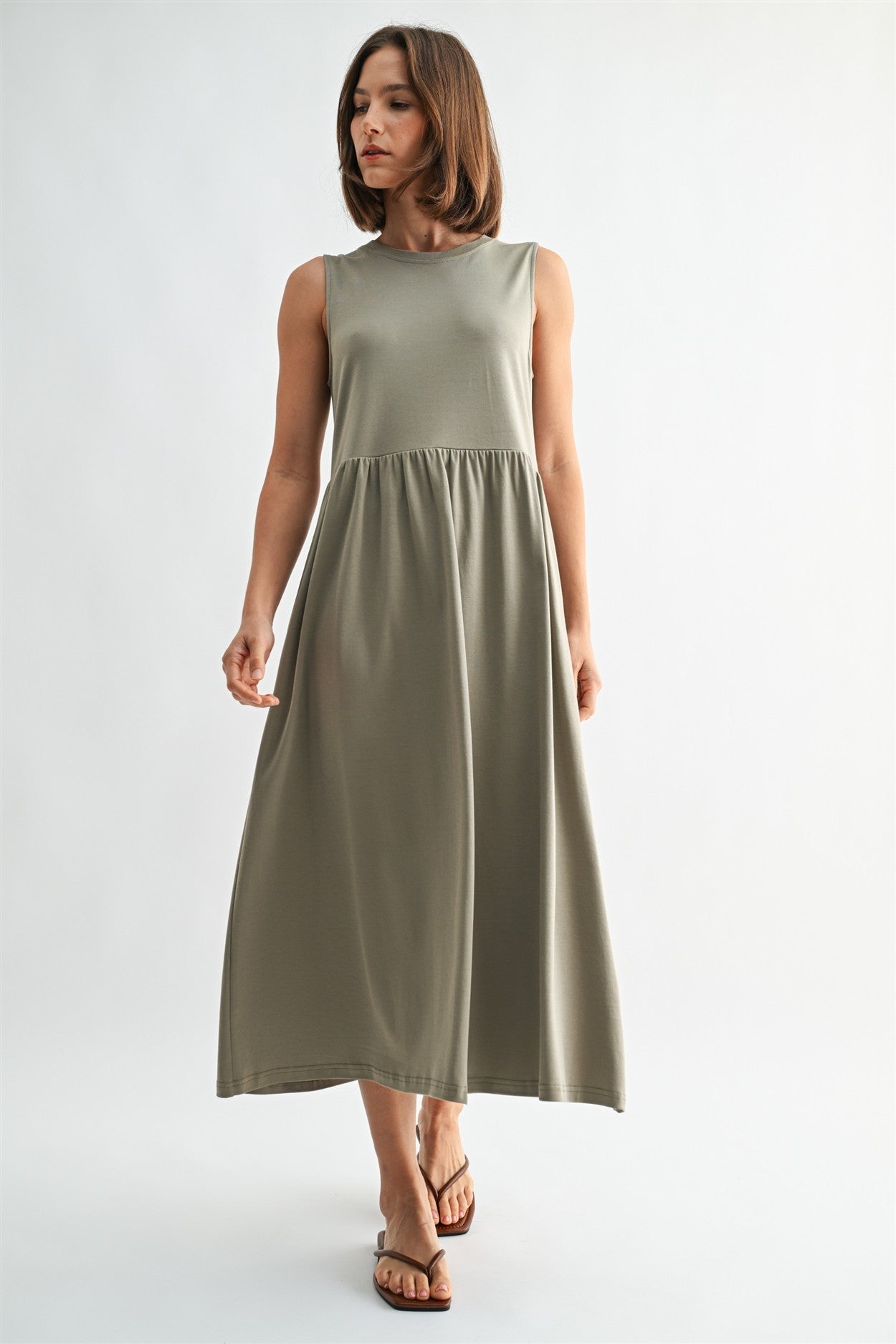 Olive knit tank midi dress. T-shirt neck with pockets. 