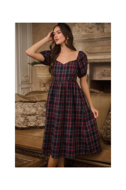A women's navy multi plaid midi dress featuring short puff sleeves, a sweetheart neckline, a fitted waist, and deep side pockets.
