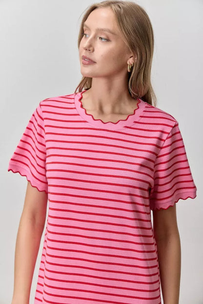 A short-sleeve striped midi t-shirt dress in pink and red featuring a classic crew neckline with scalloped trim and matching scallop-edge sleeve hems.