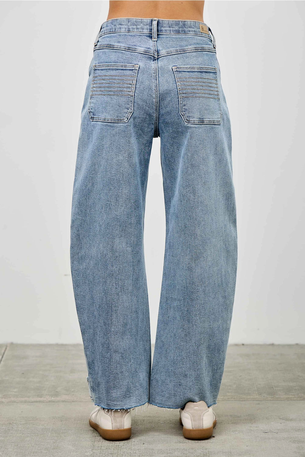 Medium wash barrel denim jeans. 
Button and zipper closure 
Front pleated details
False front cuff
Back pockets