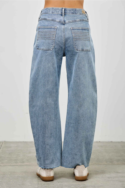 Medium wash barrel denim jeans. 
Button and zipper closure 
Front pleated details
False front cuff
Back pockets