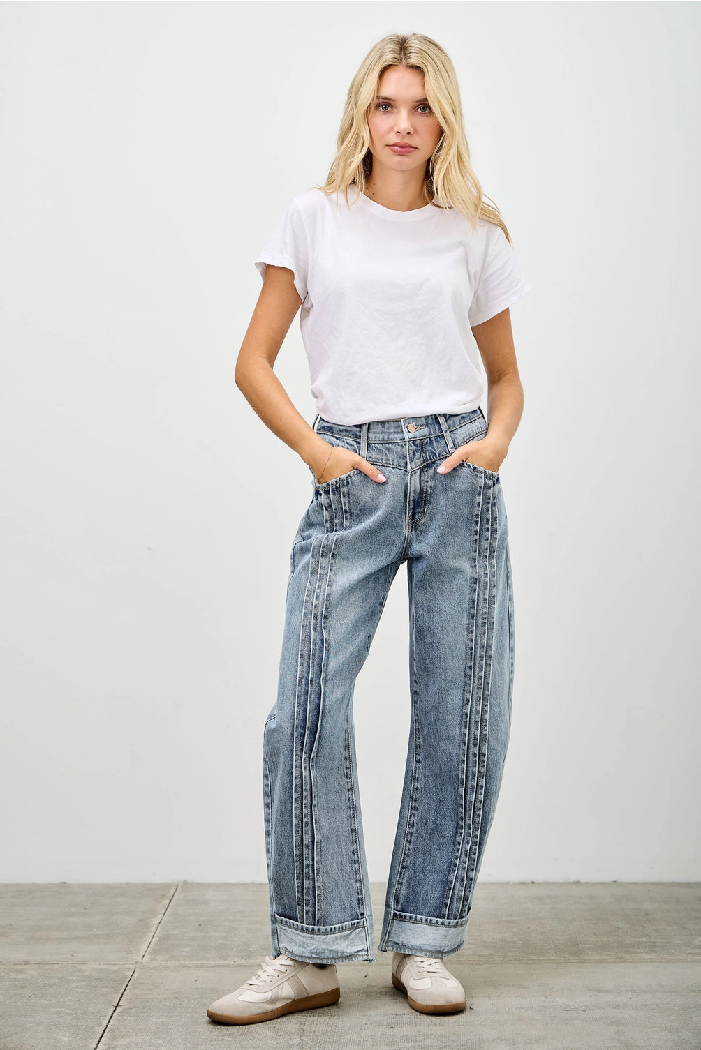 Medium wash barrel denim jeans. 
Button and zipper closure 
Front pleated details
False front cuff