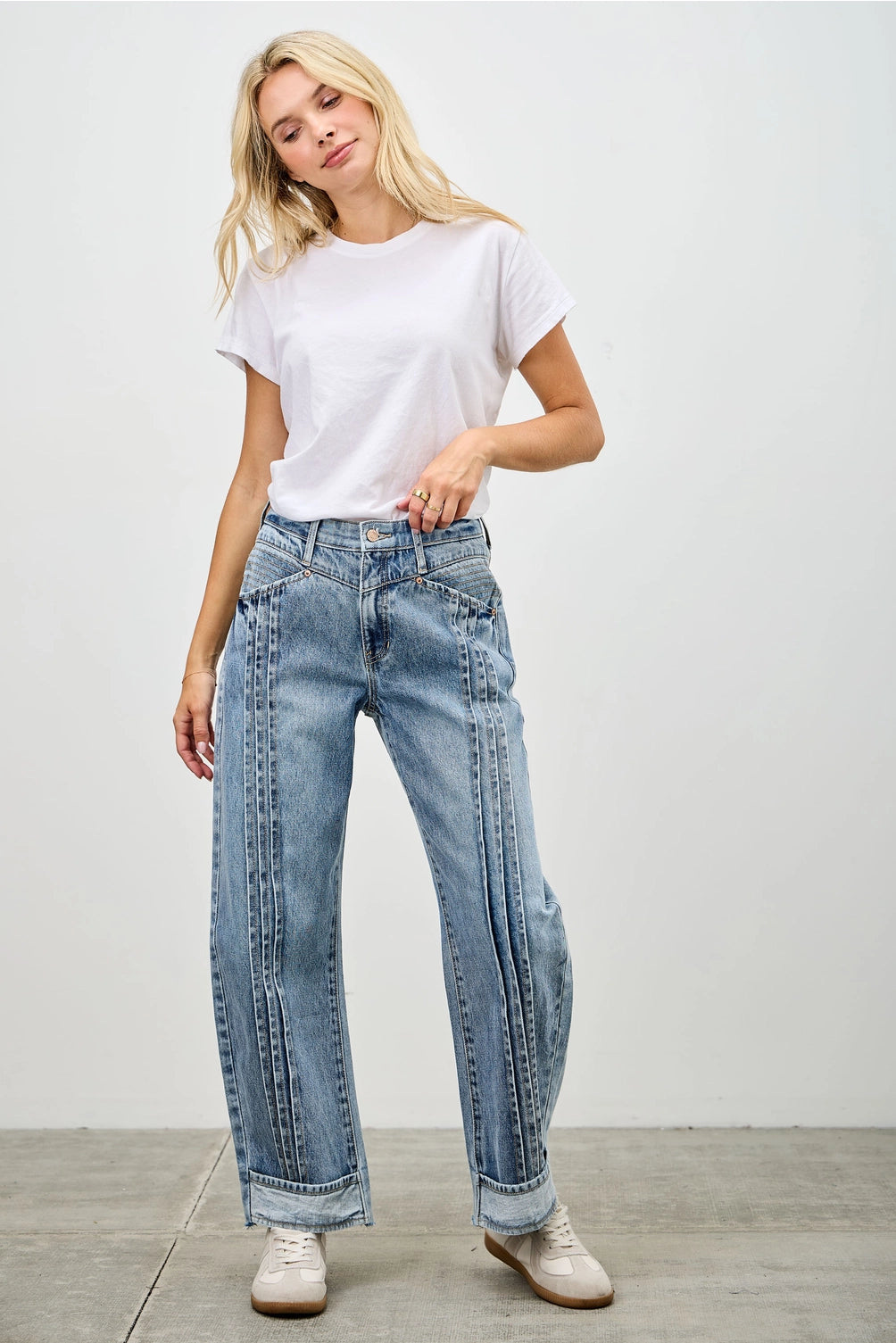 Medium wash barrel denim jeans. 
Button and zipper closure 
Front pleated details
False front cuff