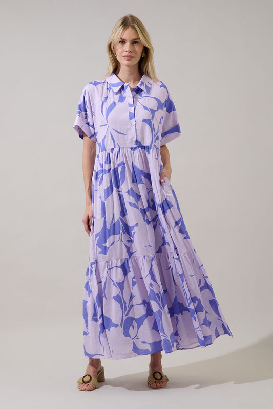 Button-down floral maxi in lavender. Oversized flowy fit, with a collar, cuff sleeves, and pockets. 