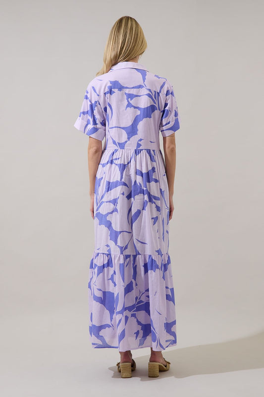 Button-down floral maxi in lavender. Oversized flowy fit, with a collar, cuff sleeves, and pockets. 